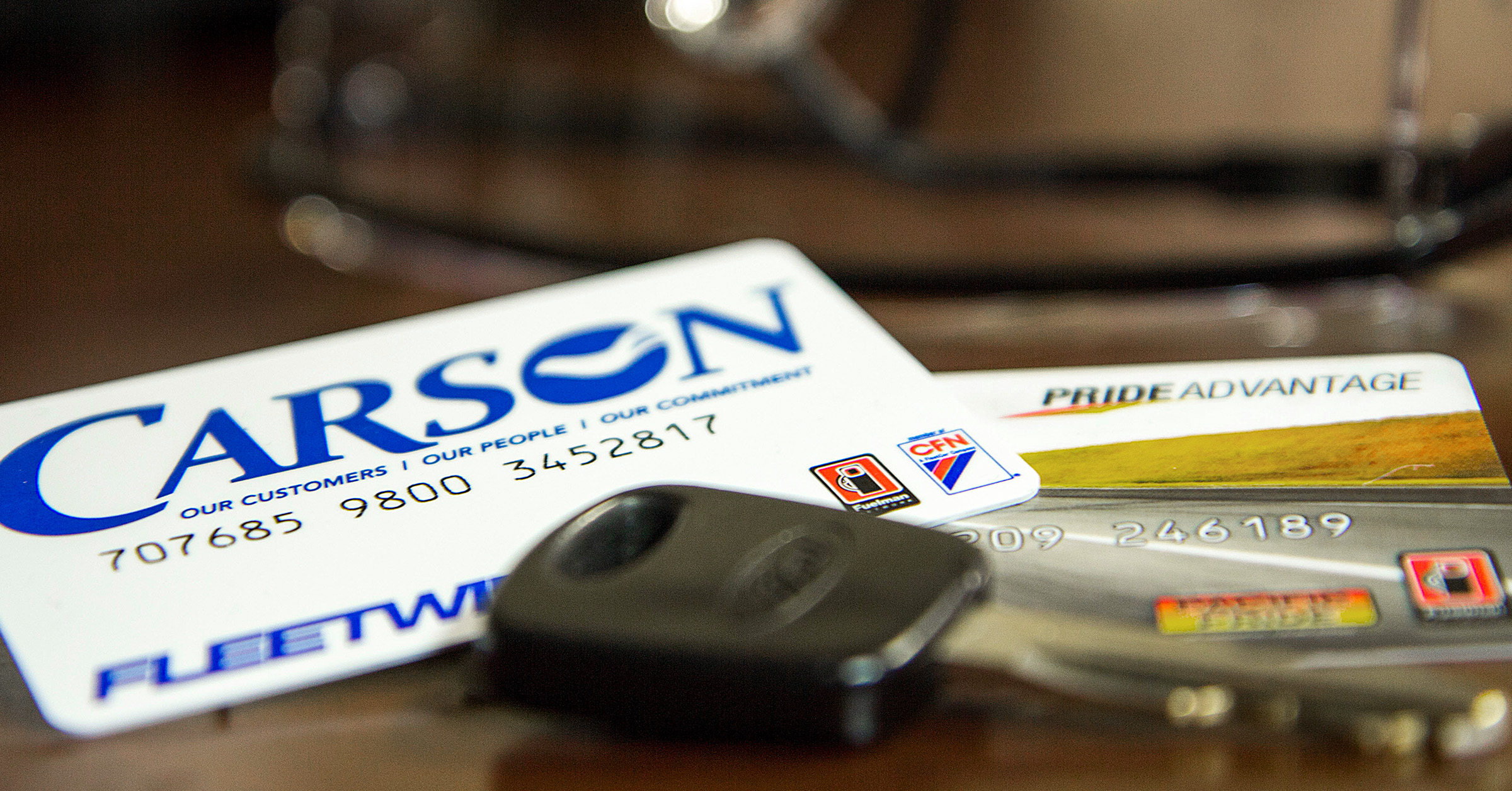 Carson fleet fuel cards on a table with keys