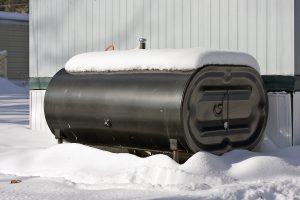 snow covered heating oil tank